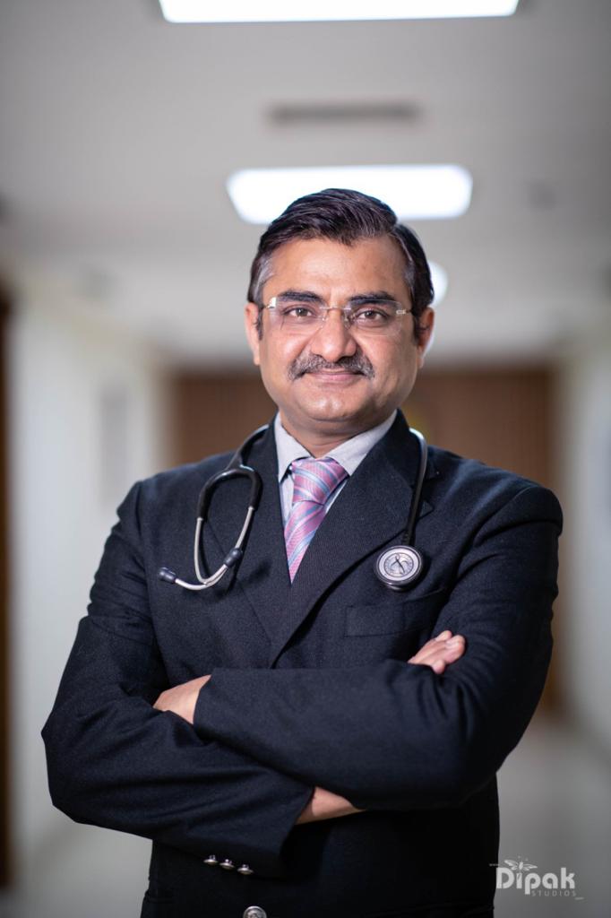 Dr. Vijay Kumar Agrawal, pulmonologist, in a hospital corridor